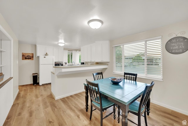 735 W 100 S, Payson, UT 84651 - dining space featuring light wood-style floors, healthy amount of natural light, and baseboards