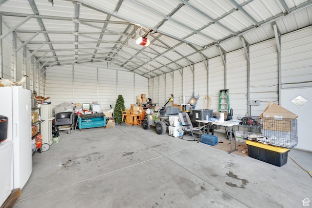 735 W 100 S, Payson, UT 84651 - garage with metal wall, a garage door opener, and freestanding refrigerator