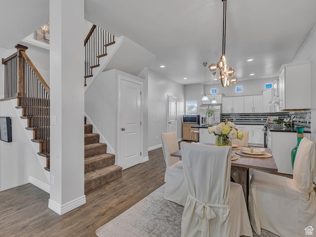 3877 S 1655 W, West Valley City, UT 84119 - dining area featuring dark wood-style floors, stairway, recessed lighting, a chandelier, and baseboards