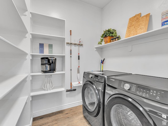 3877 S 1655 W, West Valley City, UT 84119 - laundry room featuring washing machine and clothes dryer, wood finished floors, and baseboards