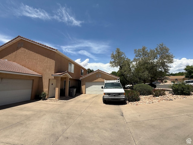 1087 N 1800th Cir W, St George, UT 84770 - view of front facade featuring stucco siding and a detached garage