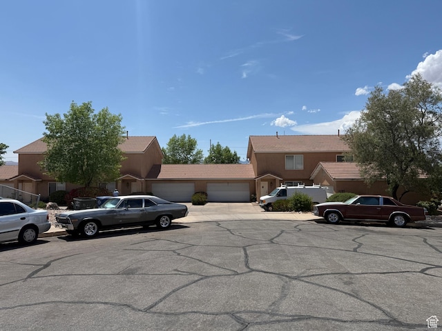 1087 N 1800th Cir W, St George, UT 84770 - view of front of property featuring driveway, stucco siding, and a garage