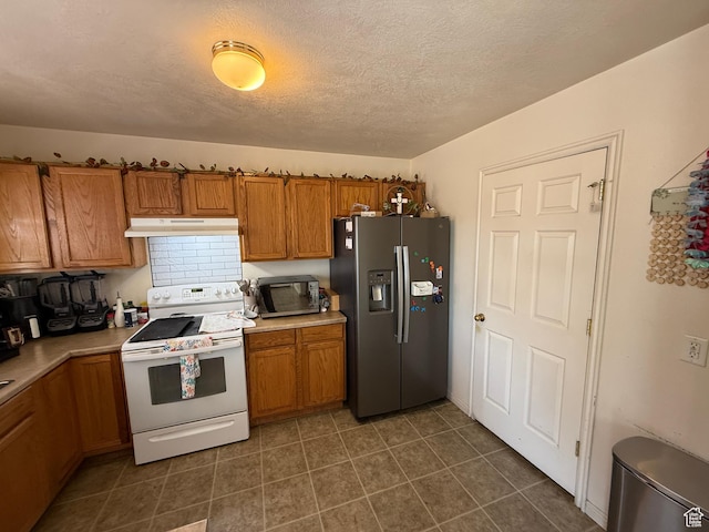 1087 N 1800th Cir W, St George, UT 84770 - kitchen featuring stainless steel fridge, white electric range, under cabinet range hood, brown cabinets, and light countertops