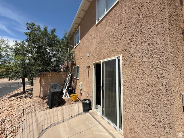 1087 N 1800th Cir W, St George, UT 84770 - view of side of home featuring stucco siding and a patio