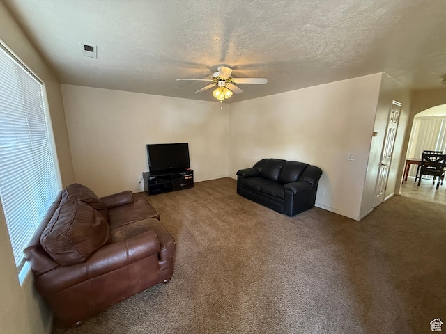 1087 N 1800th Cir W, St George, UT 84770 - carpeted living room with a ceiling fan, a textured ceiling, and arched walkways