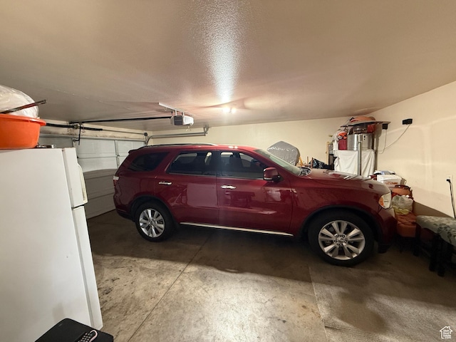 1087 N 1800th Cir W, St George, UT 84770 - garage featuring freestanding refrigerator and a garage door opener