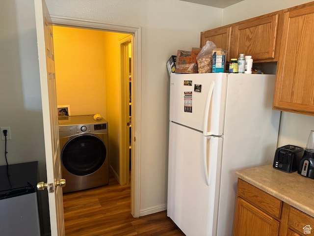 1087 N 1800th Cir W, St George, UT 84770 - kitchen featuring washer / clothes dryer, freestanding refrigerator, dark wood-style flooring, and brown cabinetry