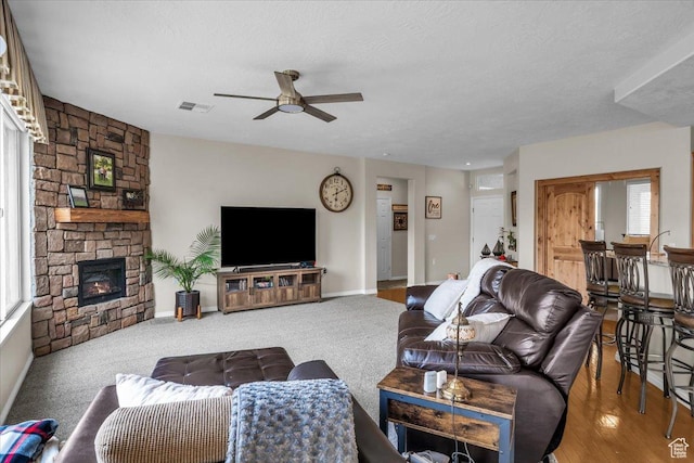 1646 W Sunkissed Dr, St George, UT 84790 - living room featuring ceiling fan, plenty of natural light, a fireplace, and baseboards