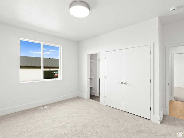 7272 W Summit Crest Cir, Herriman, UT 84096 - unfurnished bedroom with carpet floors, a closet, and ensuite bathroom