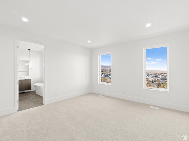 7272 W Summit Crest Cir, Herriman, UT 84096 - unfurnished bedroom with carpet floors, recessed lighting, and ensuite bath
