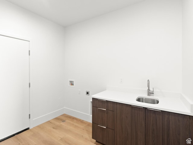 7272 W Summit Crest Cir, Herriman, UT 84096 - laundry room with electric dryer hookup, hookup for a washing machine, light wood-style floors, and cabinet space