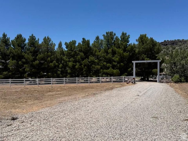 580 S Stagecoach Dr, Brookside, UT 84782 - view of dirt / gravel driveway featuring an enclosed riding area