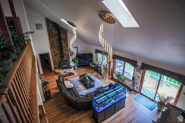 580 S Stagecoach Dr, Brookside, UT 84782 - living area with a skylight, wood finished floors, lofted ceiling, and a wood stove