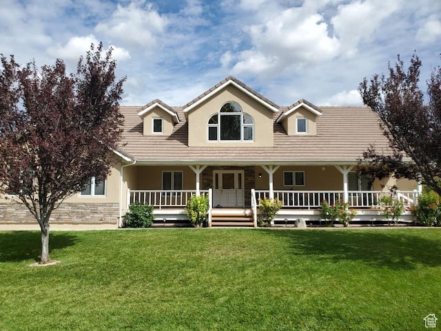 580 S Stagecoach Dr, Brookside, UT 84782 - view of front of house featuring stucco siding, a front lawn, covered porch, and a tile roof