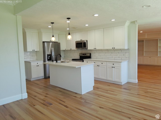 919 E Millbrook Way, Bountiful, UT 84010 - kitchen featuring appliances with stainless steel finishes, a sink, light wood-style floors, white cabinets, and recessed lighting