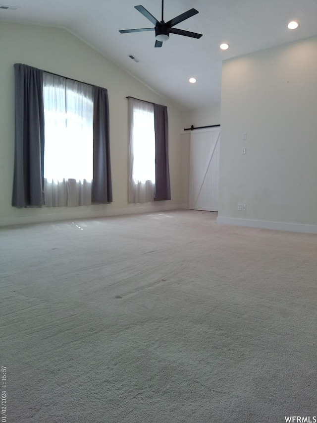 919 E Millbrook Way, Bountiful, UT 84010 - spare room featuring a barn door, vaulted ceiling, recessed lighting, light colored carpet, and a ceiling fan