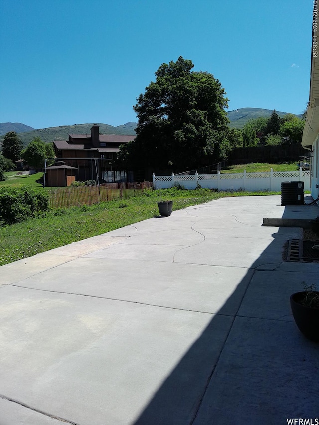 919 E Millbrook Way, Bountiful, UT 84010 - view of patio / terrace with a mountain view and central air condition unit