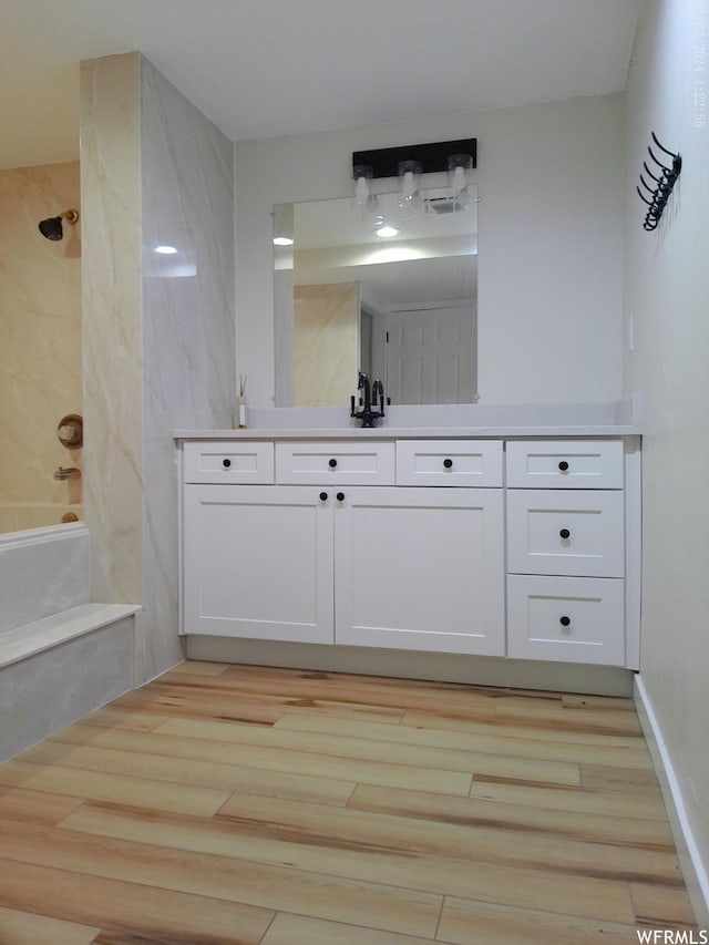 919 E Millbrook Way, Bountiful, UT 84010 - full bath featuring wood finished floors, vanity, and bathtub / shower combination