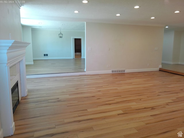 919 E Millbrook Way, Bountiful, UT 84010 - unfurnished living room with a tiled fireplace, light wood-type flooring, recessed lighting, and baseboards