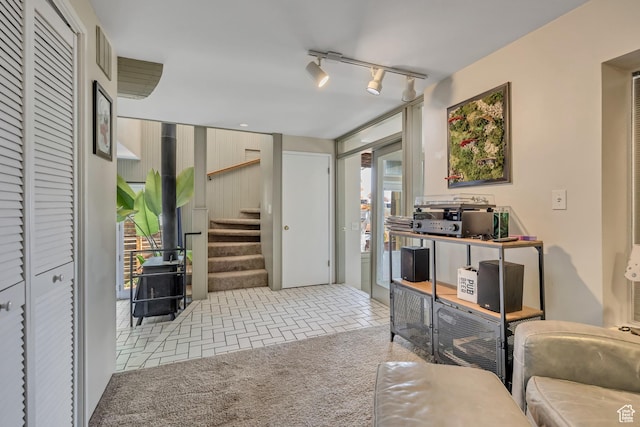 319 N Almond St W # Rear, Salt Lake City, UT 84103 - living area with healthy amount of natural light, stairs, and rail lighting