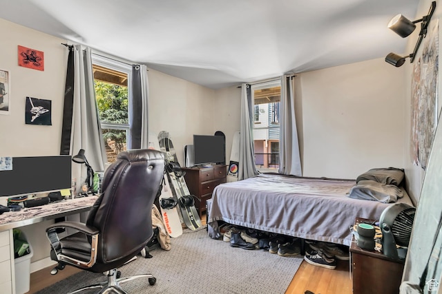 319 N Almond St W # Rear, Salt Lake City, UT 84103 - bedroom with wood finished floors and a desk