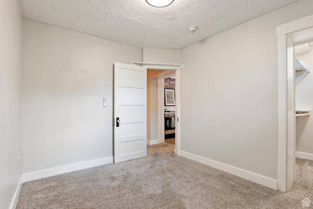 86 B St E Unit 24, Salt Lake City, UT 84150 - unfurnished bedroom with carpet, a textured ceiling, and baseboards