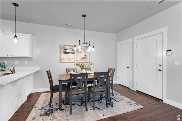 1809 W Terra Vista Ln N Unit B1, Saratoga Springs, UT 84045 - dining area featuring baseboards, dark wood-type flooring, and a chandelier