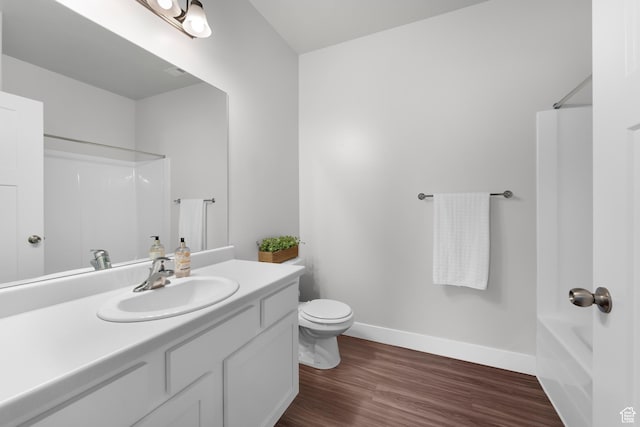 1809 W Terra Vista Ln N Unit B1, Saratoga Springs, UT 84045 - full bathroom with vanity, toilet, wood finished floors, baseboards, and bathing tub / shower combination