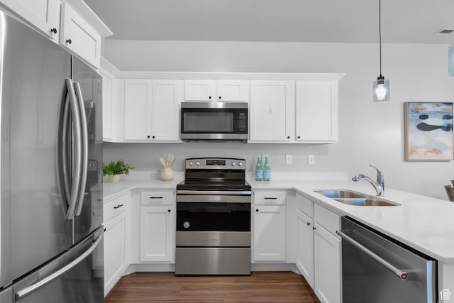 1809 W Terra Vista Ln N Unit B1, Saratoga Springs, UT 84045 - kitchen with stainless steel appliances, a sink, a peninsula, dark wood-style flooring, and white cabinetry