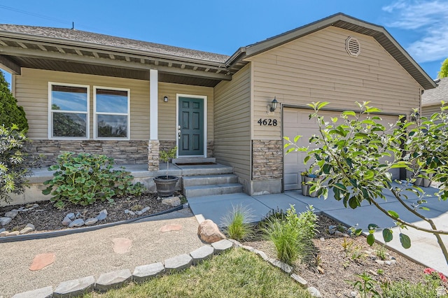 4628 N Long Way, Eagle Mountain, UT 84005 - view of front of property featuring an attached garage, stone siding, and a porch
