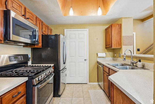 900 Bitner Rd Unit D32, Park City, UT 84098 - kitchen featuring appliances with stainless steel finishes, a sink, brown cabinetry, and light tile patterned floors