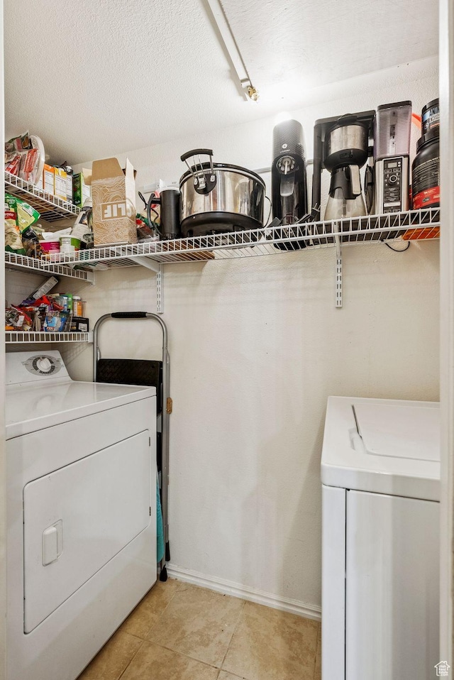 900 Bitner Rd Unit D32, Park City, UT 84098 - laundry room with washing machine and dryer, baseboards, and light tile patterned floors