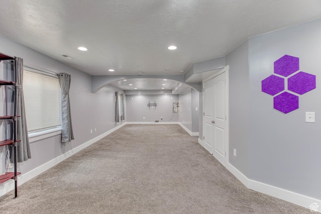 2155 N 170 W, Tooele, UT 84074 - below grade area with arched walkways, carpet, baseboards, and recessed lighting