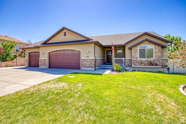 2155 N 170 W, Tooele, UT 84074 - view of front facade with stucco siding, a garage, concrete driveway, stone siding, and a shingled roof