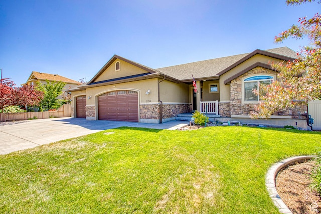 2155 N 170 W, Tooele, UT 84074 - ranch-style home featuring stone siding, stucco siding, a garage, concrete driveway, and a shingled roof