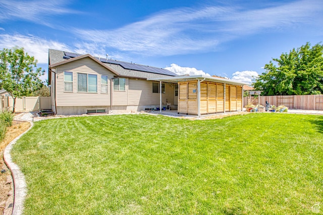 2155 N 170 W, Tooele, UT 84074 - rear view of house with solar panels and a patio area
