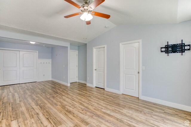 2155 N 170 W, Tooele, UT 84074 - unfurnished bedroom featuring light wood-style floors, lofted ceiling, baseboards, and a ceiling fan