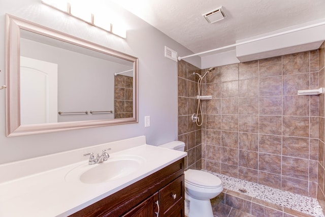 2155 N 170 W, Tooele, UT 84074 - full bathroom with toilet, vanity, and tiled shower