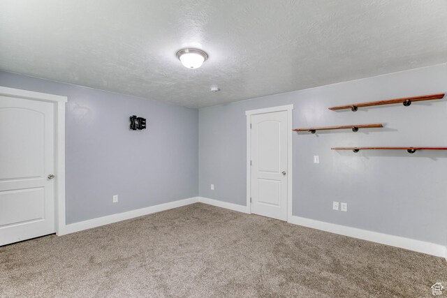 2155 N 170 W, Tooele, UT 84074 - carpeted empty room with baseboards and a textured ceiling
