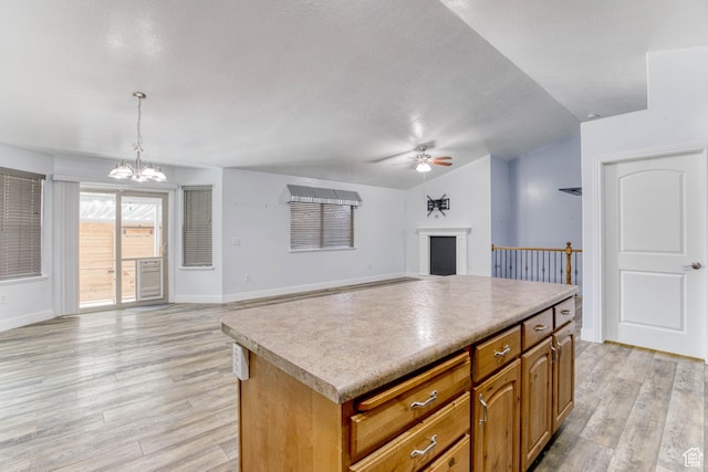 2155 N 170 W, Tooele, UT 84074 - kitchen featuring vaulted ceiling, ceiling fan, light wood finished floors, a chandelier, and baseboards