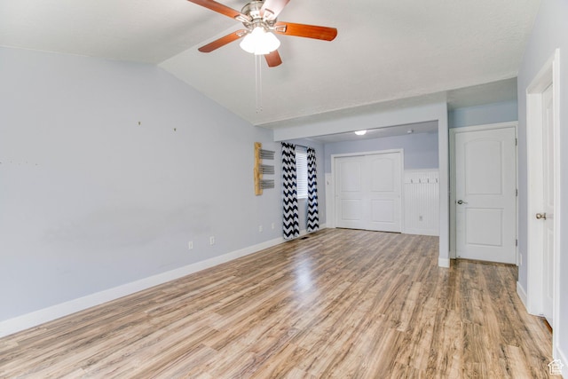 2155 N 170 W, Tooele, UT 84074 - empty room with light wood-type flooring, a ceiling fan, vaulted ceiling, and baseboards