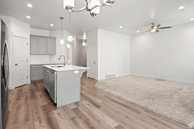 274 W 530 N Unit 329, Vineyard, UT 84059 - kitchen featuring gray cabinets, appliances with stainless steel finishes, a sink, a ceiling fan, and light wood-style floors