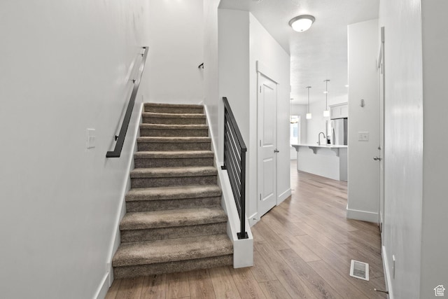 274 W 530 N Unit 329, Vineyard, UT 84059 - stairs with wood finished floors and baseboards