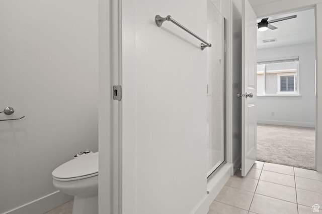 274 W 530 N Unit 329, Vineyard, UT 84059 - bathroom featuring tile patterned floors, baseboards, a shower stall, and toilet