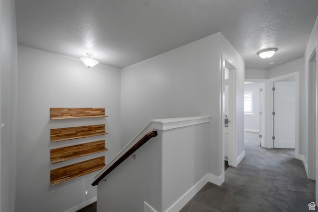 2185 W Crestview Dr, Lehi, UT 84043 - hallway with an upstairs landing, a textured ceiling, baseboards, and carpet flooring