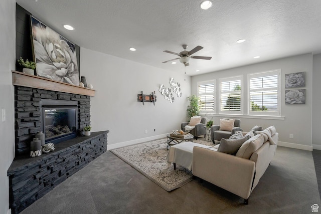 2185 W Crestview Dr, Lehi, UT 84043 - carpeted living area featuring baseboards, ceiling fan, recessed lighting, a stone fireplace, and a textured ceiling