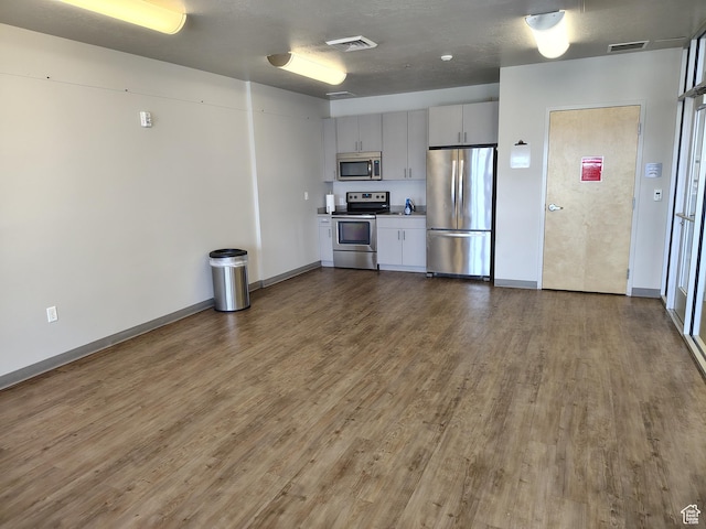 2185 W Crestview Dr, Lehi, UT 84043 - kitchen with appliances with stainless steel finishes, wood finished floors, baseboards, and light countertops