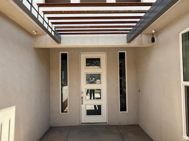 410 N 2720 E, St George, UT 84790 - doorway to property with stucco siding and a pergola
