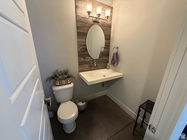410 N 2720 E, St George, UT 84790 - half bathroom with toilet, baseboards, and concrete floors