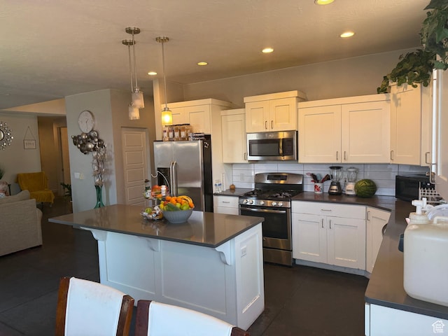 410 N 2720 E, St George, UT 84790 - kitchen featuring stainless steel appliances, dark countertops, tasteful backsplash, white cabinetry, and recessed lighting